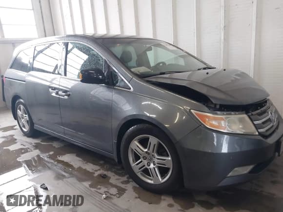 ✅ 2012 Honda Odyssey Touring • VIN: 5FNRL5H92CB106325 • Lot: 43287538. Listed on IAAI with 206,962 mi. Free auction sales archive from the USA and detailed vehicle history report at DreamBid. Image 13.