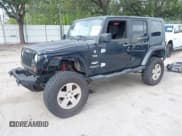 ✅ 2007 Jeep Wrangler Unlimited Sahara • VIN: 1J8GA59187L104774 • Lot: 42485359. Listed on IAAI with 192,254 mi. Free auction sales archive from the USA and detailed vehicle history report at DreamBid. Image 2.