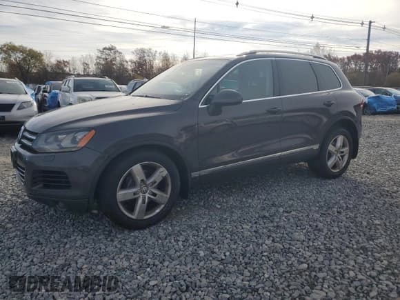 ✅ 2013 Volkswagen Touareg Sport • VIN: WVGEP9BP3DD000942 • Lot: 91008645. Listed on Copart with 157,017 mi. Free auction sales archive from the USA and detailed vehicle history report at DreamBid. Image 1.