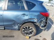 ✅ 2016 Mazda CX-5 Grand Touring • VIN: JM3KE4DY4G0916411 • Lot: 43258525. Wystawiony na IAAI z przebiegiem 48 743 mil. Bezpłatny archiwum sprzedaży aukcyjnych z USA i szczegółowy raport historii pojazdu na DreamBid. Zdjęcie 6.