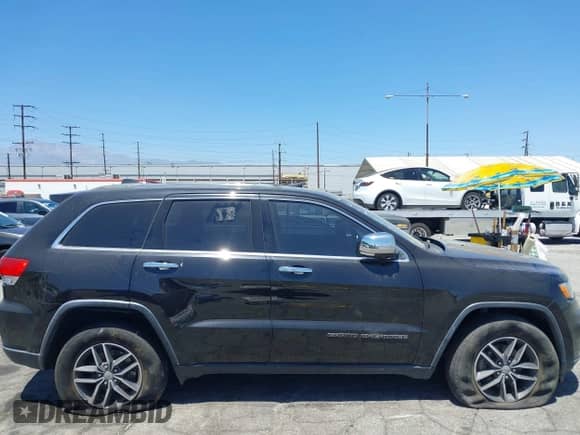 2018 Jeep Grand Cherokee Limited z VIN 1C4RJEBG5JC512008, wystawiony jako IAAI lot #42897081 z przebiegiem 141 938 mil mil oraz . Historia ofert i sprzedaży dostępna na DreamBid. Obrazek 19.