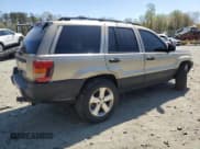 ✅ 2001 Jeep Grand Cherokee Laredo • VIN: 1J4GW48SX1C621136 • Lot: 53713195. Listed on Copart with 252,444 mi. Free auction sales archive from the USA and detailed vehicle history report at DreamBid. Image 3.