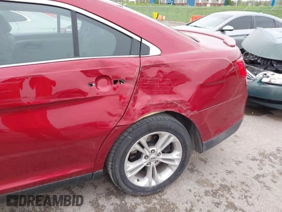 ✅ 2014 Ford Taurus SEL • VIN: 1FAHP2E94EG152207 • Лот: 42056193. Опубликован ранее на IAAI с пробегом 132 826 миль. Бесплатный доступ к архиву аукционных продаж из США и подробный отчёт об истории автомобиля на DreamBid. Изображение 6.