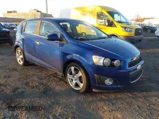 ✅ 2013 Chevrolet Sonic LTZ • VIN: 1G1JE6SB5D4104787 • Lot: 43723401. Listed on IAAI with 121,129 mi. Free auction sales archive from the USA and detailed vehicle history report at DreamBid. Image 1.