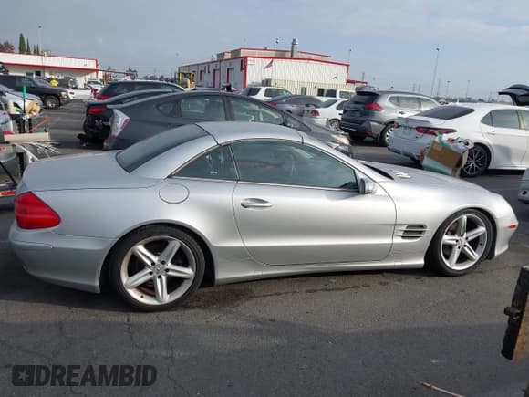✅ 2005 Mercedes-Benz SL 500 • VIN: WDBSK75FX5F089216 • Лот: 43628851. Опубликован ранее на IAAI с пробегом 131 800 миль. Бесплатный доступ к архиву аукционных продаж из США и подробный отчёт об истории автомобиля на DreamBid. Изображение 13.