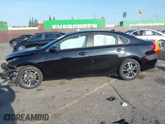 ✅ 2023 Kia Forte LXS • VIN: 3KPF24AD9PE552921 • Lot: 43792222. Listed on IAAI with 28,803 mi. Free auction sales archive from the USA and detailed vehicle history report at DreamBid. Image 14.
