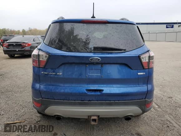 2018 Ford Escape SE z VIN 1FMCU9GD7JUA05961, wystawiony jako Copart lot #82458805 z przebiegiem Nie podano mil oraz Czysty tytuł • Clean title. Historia ofert i sprzedaży dostępna na DreamBid. Obrazek 6.