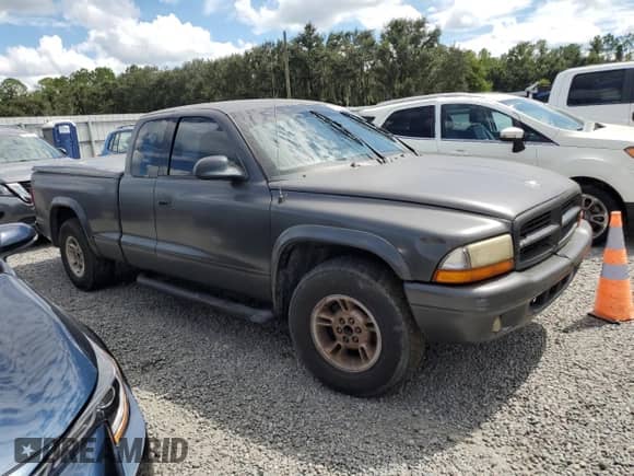 2002 Dodge Dakota Sport z VIN 1B7GL32X62S716927, wystawiony jako Copart lot #74025774 z przebiegiem Nie podano mil oraz Szkoda całkowita • Salvage title. Historia ofert i sprzedaży dostępna na DreamBid. Obrazek 4.