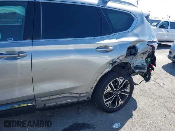 ✅ 2020 Hyundai Santa Fe Limited • VIN: 5NMS5CAA0LH186839 • Лот: 41981573. Опубликован ранее на IAAI с пробегом 68 751 миль. Бесплатный доступ к архиву аукционных продаж из США и подробный отчёт об истории автомобиля на DreamBid. Изображение 6.