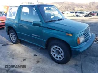 ✅ 1995 Suzuki Sidekick • VIN: 2S3TA02C3S6414337 • Lot: 86304134. Listed on Copart with 104,889 mi. Free auction sales archive from the USA and detailed vehicle history report at DreamBid. Image 4.