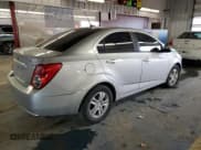 ✅ 2012 Chevrolet Sonic LS • VIN: 1G1JB5SH3C4147403 • Lot: 45127045. Listed on Copart with 117,105 mi. Free auction sales archive from the USA and detailed vehicle history report at DreamBid. Image 3.