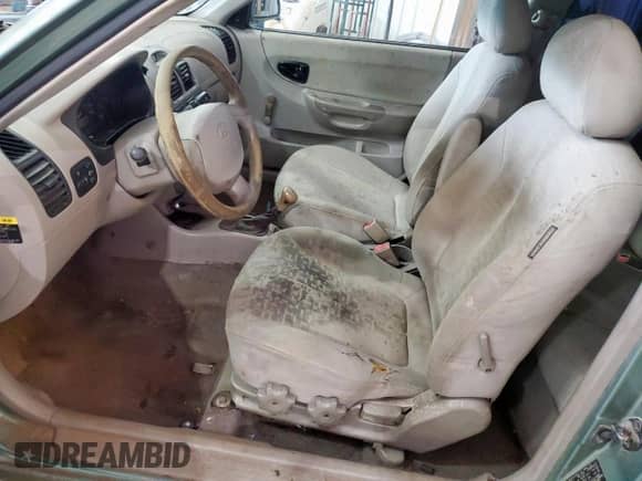 2005 Hyundai Accent GLS with VIN KMHCG35CX5U335467, listed as a Copart auction lot 61091895 with Not provided miles and Salvage title. Bid and sale history available at DreamBid. Image 7.