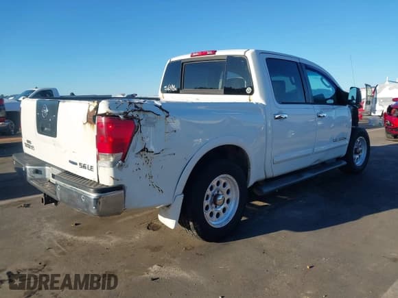 ✅ 2009 Nissan Titan LE • VIN: 1N6BA07D79N318614 • Lot: 43460475. Listed on IAAI with 232,157 mi. Free auction sales archive from the USA and detailed vehicle history report at DreamBid. Image 4.