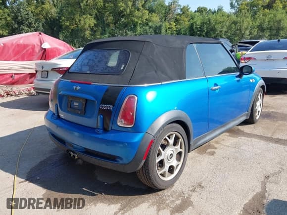 ✅ 2007 MINI Convertible S • VIN: WMWRH335X7TJ43665 • Lot: 43154907. Listed on IAAI with 143,631 mi. Free auction sales archive from the USA and detailed vehicle history report at DreamBid. Image 4.