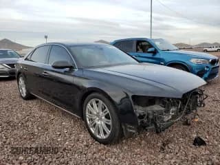 ✅ 2015 Audi A8 4.0T • VIN: WAU32AFDXFN041218 • Лот: 78935623. Опубликован ранее на Copart с пробегом 103 310 миль. Бесплатный доступ к архиву аукционных продаж из США и подробный отчёт об истории автомобиля на DreamBid. Изображение 4.