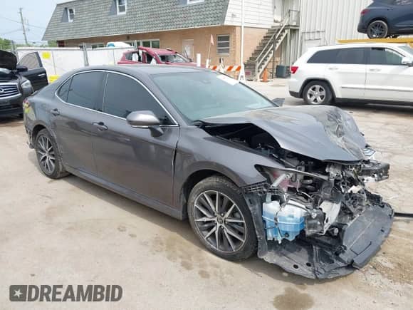 2022 Toyota Camry Hybrid XLE with VIN 4T1F31AK2NU573291, listed as a IAAI auction lot 42407207 with 65,222 mi miles and . Bid and sale history available at DreamBid. Image 1.