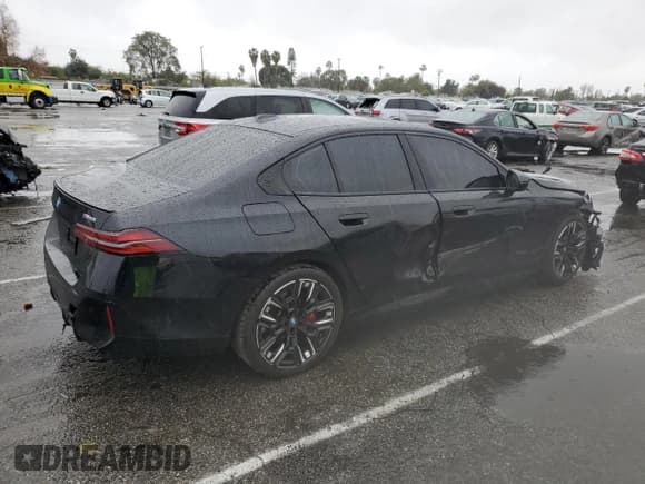 ✅ 2024 BMW i5 M60 • VIN: WBY43FK06RCR21920 • Lot: 43002445. Listed on Copart with 26,452 mi. Free auction sales archive from the USA and detailed vehicle history report at DreamBid. Image 3.