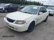 ✅ 2002 Mazda Protege DX • VIN: JM1BJ225721631223 • Lot: 42551233. Wystawiony na IAAI z przebiegiem 247 716 mil. Bezpłatny archiwum sprzedaży aukcyjnych z USA i szczegółowy raport historii pojazdu na DreamBid. Zdjęcie 2.