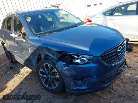 ✅ 2016 Mazda CX-5 Grand Touring • VIN: JM3KE2DY6G0769349 • Lot: 43593752. Wystawiony na IAAI z przebiegiem 80 588 mil. Bezpłatny archiwum sprzedaży aukcyjnych z USA i szczegółowy raport historii pojazdu na DreamBid. Zdjęcie 1.