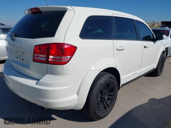 2015 Dodge Journey American Value z VIN 3C4PDCAB0FT540285, wystawiony jako IAAI lot #43610721 z przebiegiem 208 916 mil mil oraz . Historia ofert i sprzedaży dostępna na DreamBid. Obrazek 4.