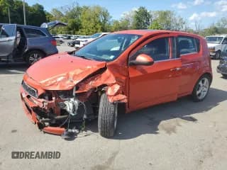 ✅ 2013 Chevrolet Sonic LTZ • VIN: 1G1JE6SB5D4208552 • Lot: 81232095. Listed on Copart with 117,434 mi. Free auction sales archive from the USA and detailed vehicle history report at DreamBid. Image 1.