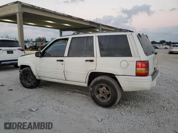 ✅ 1998 Jeep Grand Cherokee Laredo • VIN: 1J4GZ48S8WC313204 • Lot: 93124765. Listed on Copart with Not provided. Free auction sales archive from the USA and detailed vehicle history report at DreamBid. Image 2.