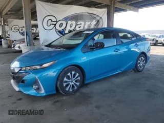 ✅ 2021 Toyota Prius LE • VIN: JTDKAMFP3M3188745 • Лот: 91725425. Опубликован ранее на Copart с пробегом 62 271 миль. Бесплатный доступ к архиву аукционных продаж из США и подробный отчёт об истории автомобиля на DreamBid. Изображение 1.
