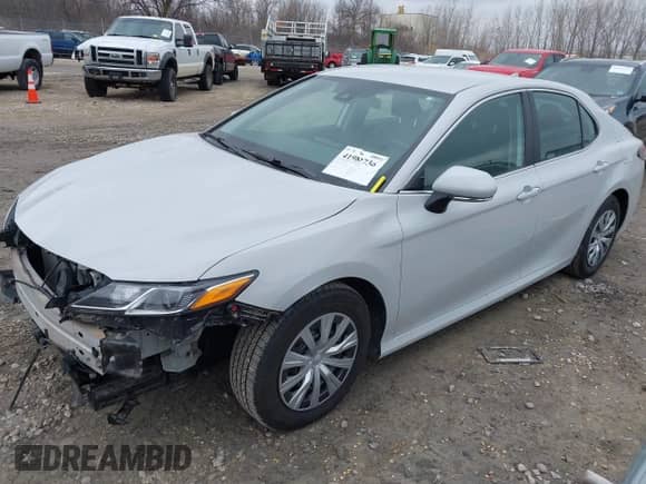 2023 Toyota Camry Hybrid LE with VIN 4T1C31AK8PU052114, listed as a IAAI auction lot 41982736 with 81,059 mi miles and . Bid and sale history available at DreamBid. Image 2.