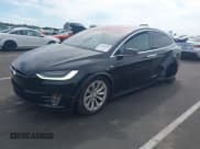 ✅ 2017 Tesla Model X 90D • VIN: 5YJXCBE20HF034559 • Lot: 43064010. Listed on IAAI with 164,144 mi. Free auction sales archive from the USA and detailed vehicle history report at DreamBid. Image 2.