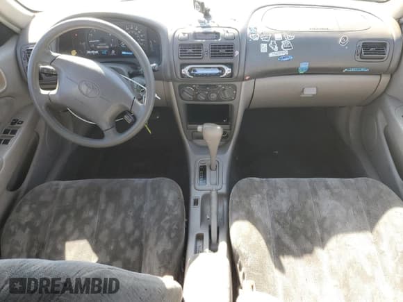 ✅ 1998 Toyota Corolla LE • VIN: 1NXBR18E5WZ099366 • Лот: 87099535. Опубликован ранее на Copart с пробегом 173 725 миль. Бесплатный доступ к архиву аукционных продаж из США и подробный отчёт об истории автомобиля на DreamBid. Изображение 8.