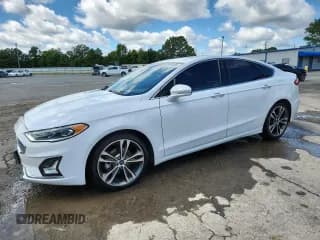 ✅ 2020 Ford Fusion Titanium • VIN: 3FA6P0D99LR174786 • Lot: 83961605. Listed on Copart with 144,644 mi. Free auction sales archive from the USA and detailed vehicle history report at DreamBid. Image 1.