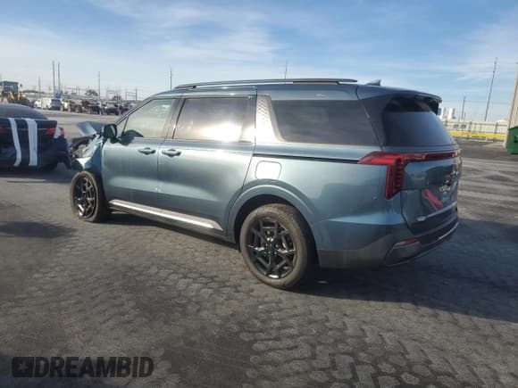 ✅ 2025 Kia Carnival SX Prestige • VIN: KNDNE5KA2S6065524 • Лот: 92487305. Опубликован ранее на Copart с пробегом 4 273 миль. Бесплатный доступ к архиву аукционных продаж из США и подробный отчёт об истории автомобиля на DreamBid. Изображение 2.