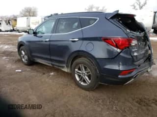 ✅ 2018 Hyundai Santa Fe 2.4L • VIN: 5NMZUDLB3JH055091 • Лот: 49159594. Опубликован ранее на Copart с пробегом 57 112 миль. Бесплатный доступ к архиву аукционных продаж из США и подробный отчёт об истории автомобиля на DreamBid. Изображение 2.