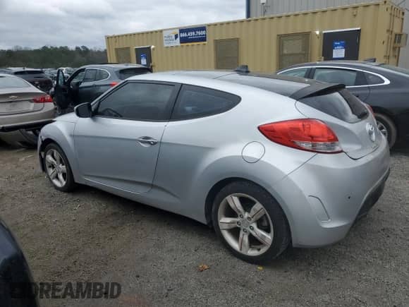 2012 Hyundai Veloster w/Red Int z VIN KMHTC6AD2CU021143, wystawiony jako Copart lot #44055345 z przebiegiem Nie podano mil oraz Czysty tytuł • Clean title. Historia ofert i sprzedaży dostępna na DreamBid. Obrazek 2.