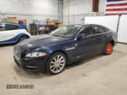 ✅ 2014 Jaguar XJ • VIN: SAJWA1CZ4E8V70391 • Лот: 52708345. Опубликован ранее на Copart с пробегом 100 229 миль. Бесплатный доступ к архиву аукционных продаж из США и подробный отчёт об истории автомобиля на DreamBid. Изображение 1.