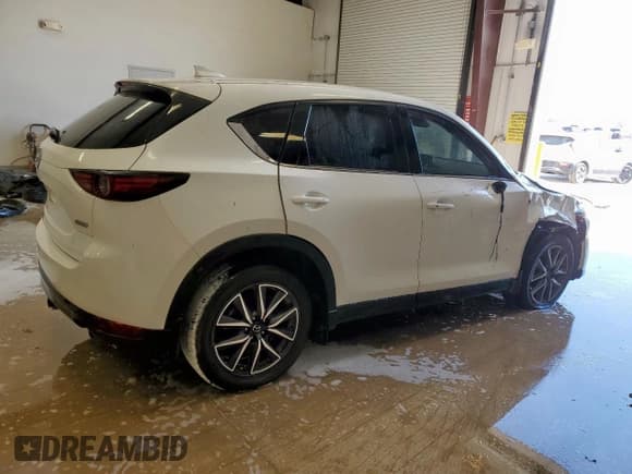 ✅ 2018 Mazda CX-5 Grand Touring • VIN: JM3KFBDM7J0344272 • Лот: 81642645. Опубликован ранее на Copart с пробегом 80 955 миль. Бесплатный доступ к архиву аукционных продаж из США и подробный отчёт об истории автомобиля на DreamBid. Изображение 3.