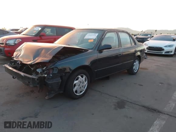 ✅ 1999 Toyota Corolla CE • VIN: 1NXBR12EXXZ252527 • Lot: 43668301. Listed on IAAI with 134,473 mi. Free auction sales archive from the USA and detailed vehicle history report at DreamBid. Image 2.