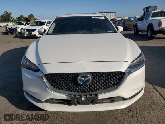 ✅ 2021 Mazda 6 Touring • VIN: JM1GL1VM0M1611282 • Лот: 85930235. Опубликован ранее на Copart с пробегом 124 447 миль. Бесплатный доступ к архиву аукционных продаж из США и подробный отчёт об истории автомобиля на DreamBid. Изображение 5.