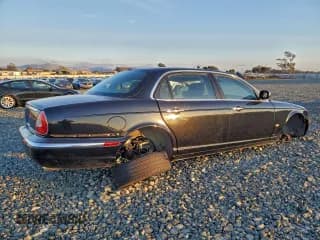 ✅ 2006 Jaguar XJ Vanden Plas • VIN: SAJWA82B96SH09791 • Lot: 93992055. Listed on Copart with 174,044 mi. Free auction sales archive from the USA and detailed vehicle history report at DreamBid. Image 3.