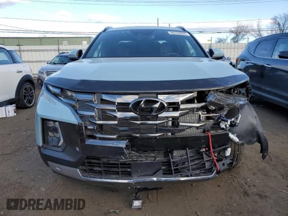 2024 Hyundai Santa Cruz Limited z VIN 5NTJEDAF7RH100548, wystawiony jako Copart lot #88242865 z przebiegiem 4 696 mil mil oraz Szkoda całkowita • Salvage title. Historia ofert i sprzedaży dostępna na DreamBid. Obrazek 5.