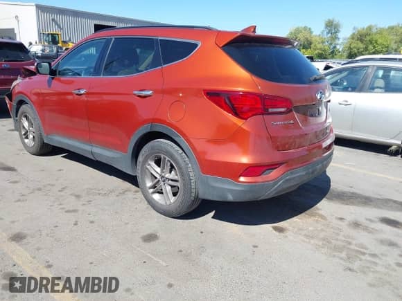 2018 Hyundai Santa Fe 2.4L z VIN 5XYZU3LB8JG523000, wystawiony jako IAAI lot #43263685 z przebiegiem 96 480 mil mil oraz . Historia ofert i sprzedaży dostępna na DreamBid. Obrazek 3.
