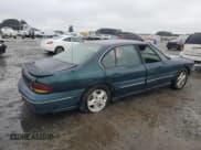 ✅ 1999 Pontiac Bonneville SE • VIN: 1G2HX52K4XH223068 • Lot: 44743945. Wystawiony na Copart z przebiegiem 183 356 mil. Bezpłatny archiwum sprzedaży aukcyjnych z USA i szczegółowy raport historii pojazdu na DreamBid. Zdjęcie 3.