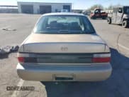 ✅ 1997 Toyota Corolla CE • VIN: 1NXBA02E9VZ613020 • Lot: 82120114. Listed on Copart with 223,147 mi. Free auction sales archive from the USA and detailed vehicle history report at DreamBid. Image 6.