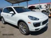 ✅ 2016 Porsche Cayenne S E-Hybrid • VIN: WP1AE2A25GLA63734 • Lot: 42549379. Listed on IAAI with 155,065 mi. Free auction sales archive from the USA and detailed vehicle history report at DreamBid. Image 1.