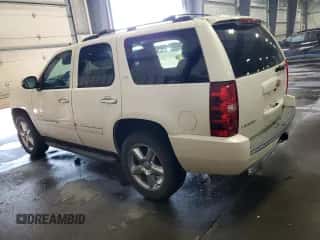 2014 Chevrolet Tahoe LTZ с VIN 1GNSKCE05ER127284, выставлен на аукционе Copart как лот 85735245 с пробегом 152 890 миль миль и Чистый • Clean title. История ставок и продаж доступна на DreamBid. Изображение 2.