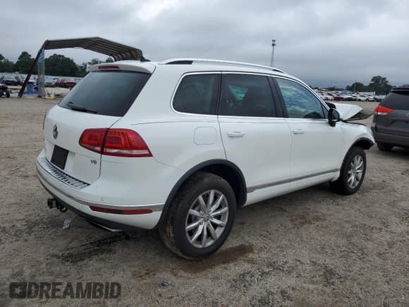 ✅ 2017 Volkswagen Touareg Sport • VIN: WVGEF7BP5HD000423 • Lot: 67561135. Listed on Copart with 112,621 mi. Free auction sales archive from the USA and detailed vehicle history report at DreamBid. Image 3.