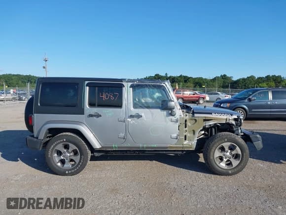 ✅ 2018 Jeep Wrangler Unlimited Sahara • VIN: 1C4HJWEG7JL893986 • Lot: 40114087. Listed on IAAI with 48,815 mi. Free auction sales archive from the USA and detailed vehicle history report at DreamBid. Image 13.