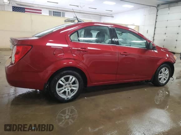 2012 Chevrolet Sonic LT z VIN 1G1JC5SB7C4222161, wystawiony jako Copart lot #45002765 z przebiegiem 94 450 mil mil oraz Czysty tytuł • Clean title. Historia ofert i sprzedaży dostępna na DreamBid. Obrazek 3.