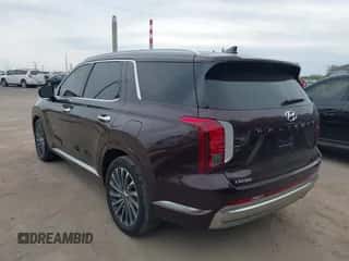 2023 Hyundai Palisade Calligraphy z VIN KM8R7DGE8PU599157, wystawiony jako IAAI lot #43403503 z przebiegiem 38 922 mil mil oraz . Historia ofert i sprzedaży dostępna na DreamBid. Obrazek 3.