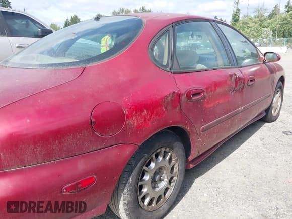 ✅ 1997 Ford Taurus LX • VIN: 1FALP53S4VG148062 • Лот: 42576718. Опубликован ранее на IAAI с пробегом 197 309 миль. Бесплатный доступ к архиву аукционных продаж из США и подробный отчёт об истории автомобиля на DreamBid. Изображение 6.